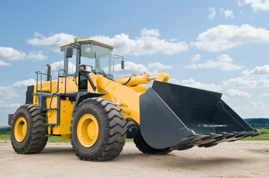 An image of a yellow front loader