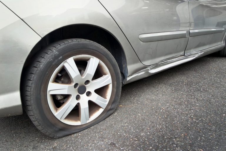 Flat rear tire on a car