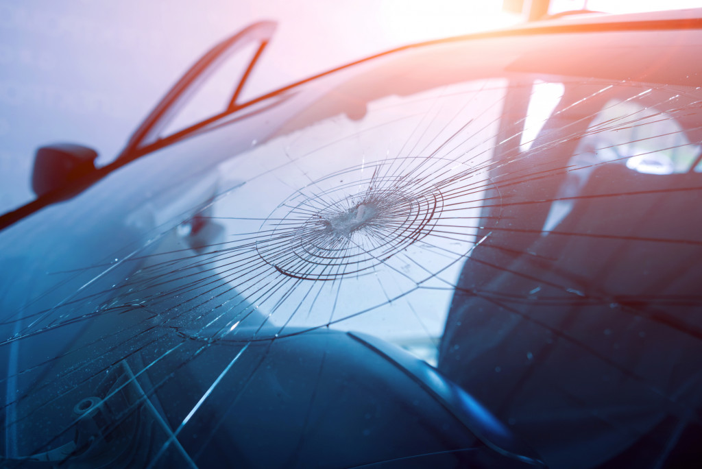 A broken windshield on a car